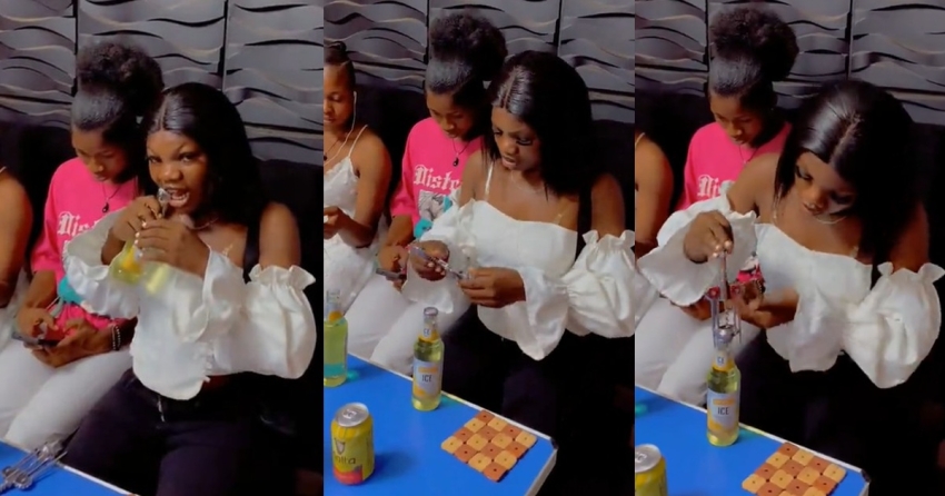Lady strúggles with the bottle opener at a club, resorts to using her teeth (VIDEO)